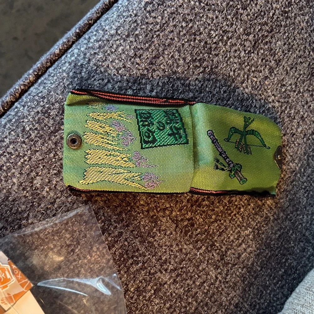 Green Embroidered Fabric Pouch for coins. Made in Japan. Recycled materials.
